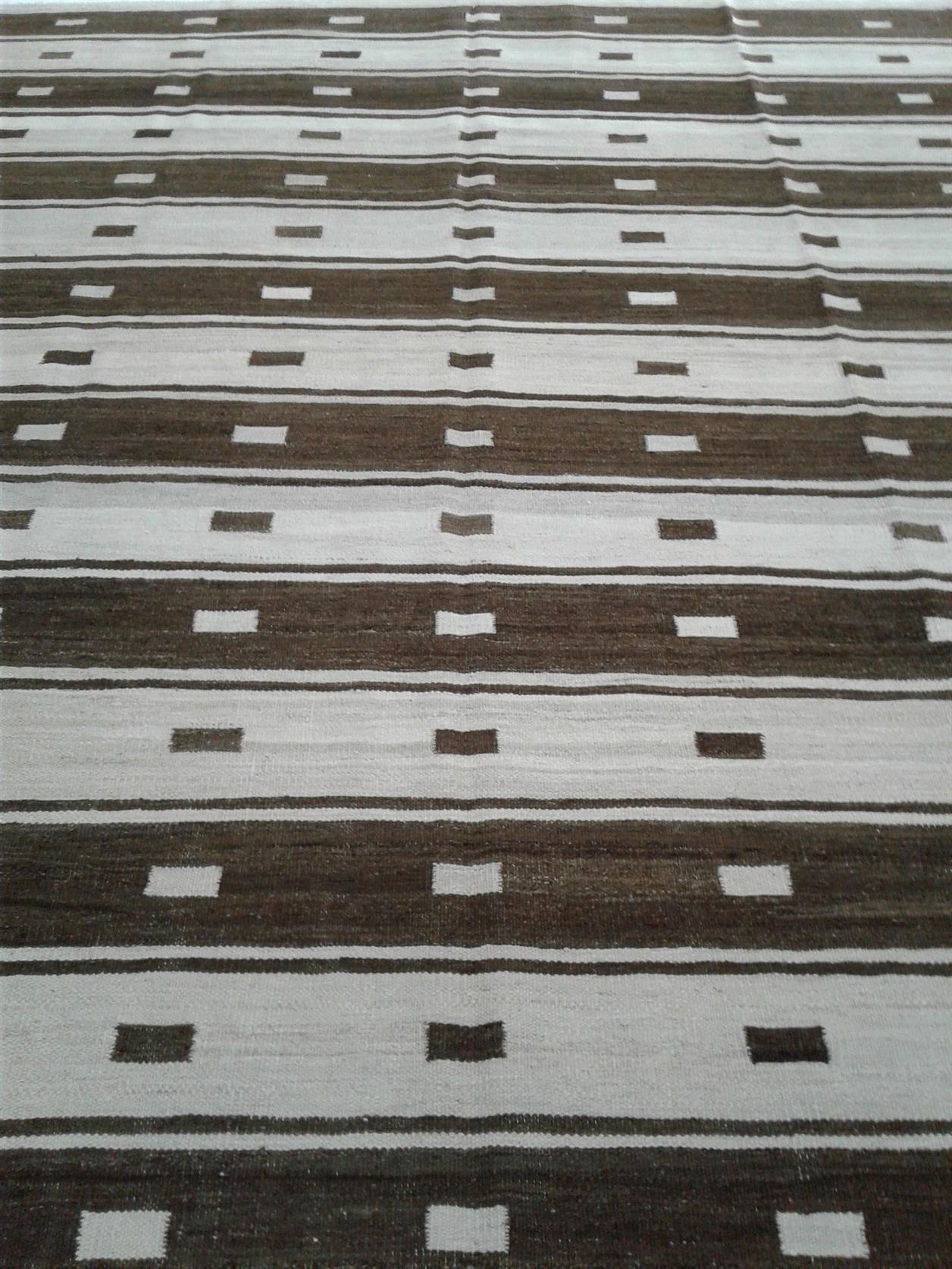 Explore our exquisite collection of handmade rugs, ranging from antique and vintage to modern designs. Each rug is a testament to skilled craftsmanship, offering timeless beauty and elegance. Elevate your space with the warmth and artistry of our handcrafted carpets.