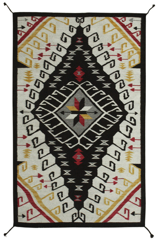 A rectangular Southwestern-style woven rug with a bold geometric pattern, featuring a black central diamond, cream side panels, and accents of red, yellow, and gray. Atlantica Organics curates antique and handmade rugs, Persian, Afghan, Tibetan, Pakistani, Turkish Oushak, Kilim, Khotan, tribal and contemporary textiles for luxury interiors, homes and real estate. Our collections connect timeless craftsmanship with interior design, furniture, fine art, architecture and modern living. Explore curated rugs, co