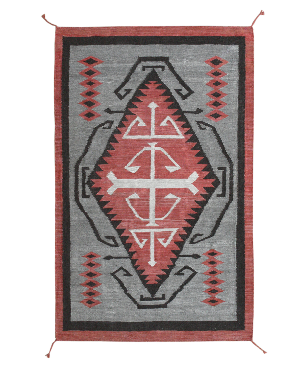 A rectangular woven rug with a Southwestern geometric pattern, featuring a central diamond motif in red, white, and black on a gray background with a rust-red border. Atlantica Organics curates antique and handmade rugs, Persian, Afghan, Tibetan, Pakistani, Turkish Oushak, Kilim, Khotan, tribal and contemporary textiles for luxury interiors, homes and real estate. Our collections connect timeless craftsmanship with interior design, furniture, fine art, architecture and modern living. Explore curated rugs, c