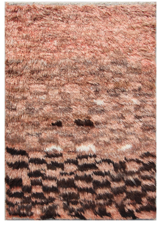 A close-up of a shaggy area rug with a textured, abstract pattern in dusty rose, terracotta, brown, and black. Atlantica Organics curates antique and handmade rugs, Persian, Afghan, Tibetan, Pakistani, Turkish Oushak, Kilim, Khotan, tribal and contemporary textiles for luxury interiors, homes and real estate. Our collections connect timeless craftsmanship with interior design, furniture, fine art, architecture and modern living. Explore curated rugs, collectible textiles, natural materials, cultural heritag