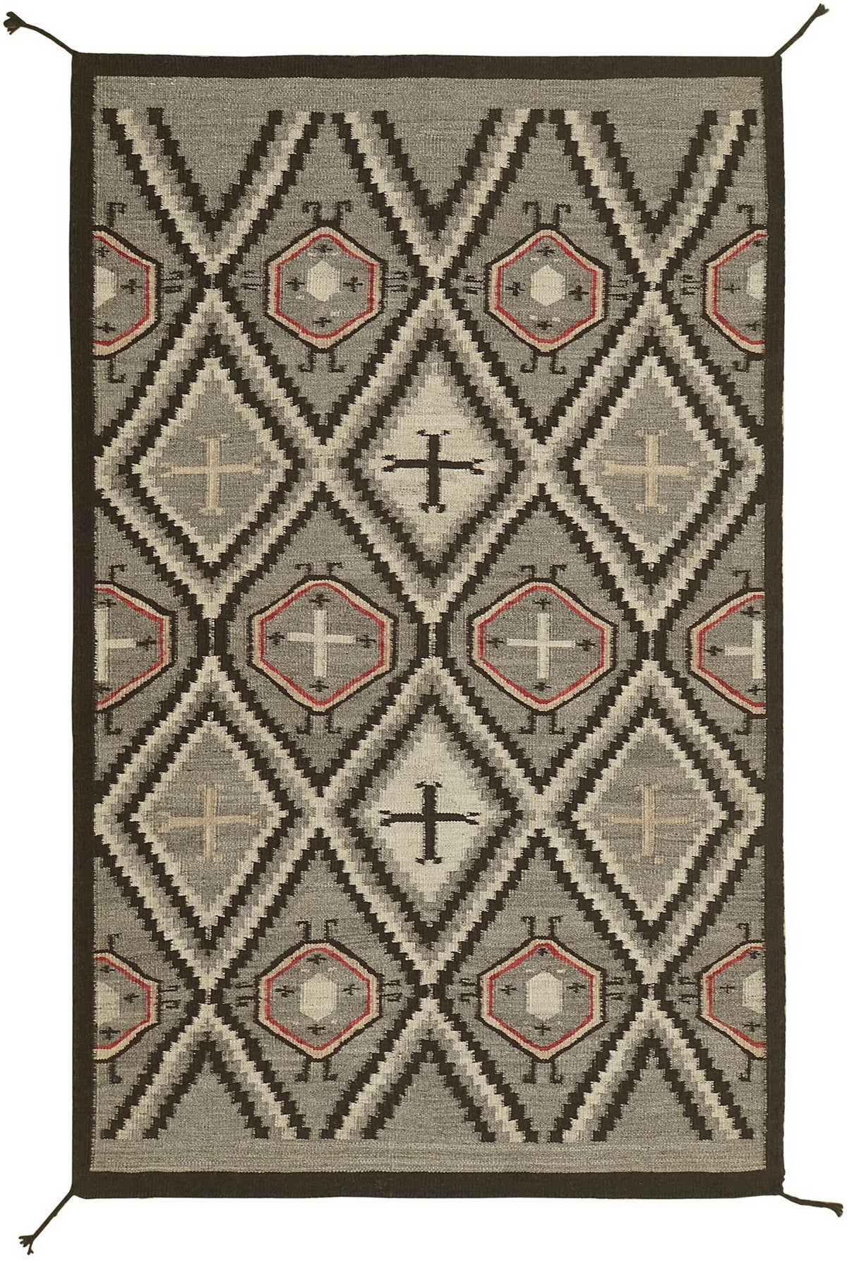 A rectangular woven rug with a Southwestern geometric pattern in gray, black, beige, and terracotta red, shown flat against a white background.Atlantica Organics curates antique and handmade rugs, Persian, Afghan, Tibetan, Pakistani, Turkish Oushak, Kilim, Khotan, tribal and contemporary textiles for luxury interiors, homes and real estate. Our collections connect timeless craftsmanship with interior design, furniture, fine art, architecture and modern living. Explore curated rugs, collectible textiles, nat