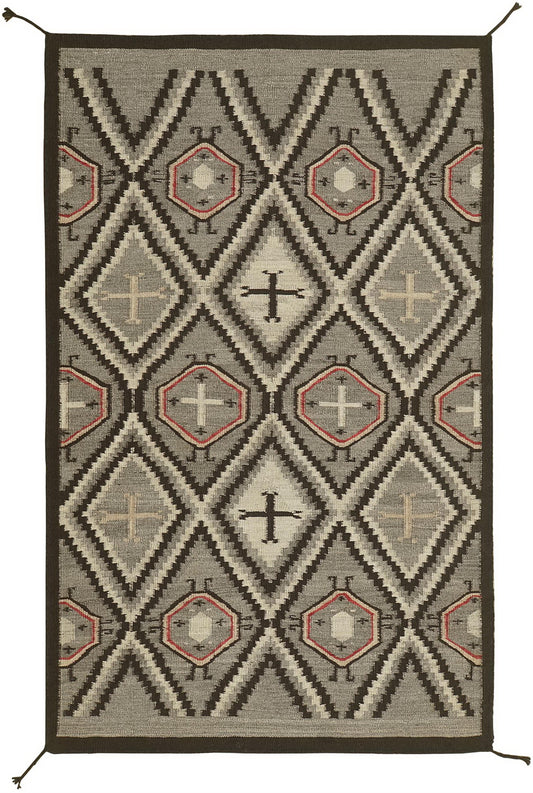 A rectangular woven rug with a Southwestern geometric pattern in gray, black, beige, and terracotta red, shown flat against a white background.Atlantica Organics curates antique and handmade rugs, Persian, Afghan, Tibetan, Pakistani, Turkish Oushak, Kilim, Khotan, tribal and contemporary textiles for luxury interiors, homes and real estate. Our collections connect timeless craftsmanship with interior design, furniture, fine art, architecture and modern living. Explore curated rugs, collectible textiles, nat