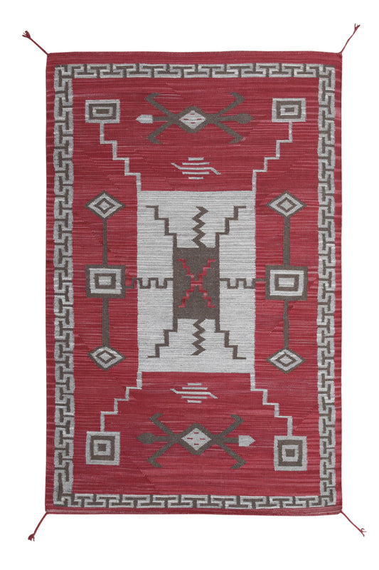 A rectangular woven area rug with a geometric Southwestern design, featuring a deep red field, a central light gray panel, and a gray border with stepped and diamond motifs. Atlantica Organics curates antique and handmade rugs, Persian, Afghan, Tibetan, Pakistani, Turkish Oushak, Kilim, Khotan, tribal and contemporary textiles for luxury interiors, homes and real estate. Our collections connect timeless craftsmanship with interior design, furniture, fine art, architecture and modern living. Explore curated 