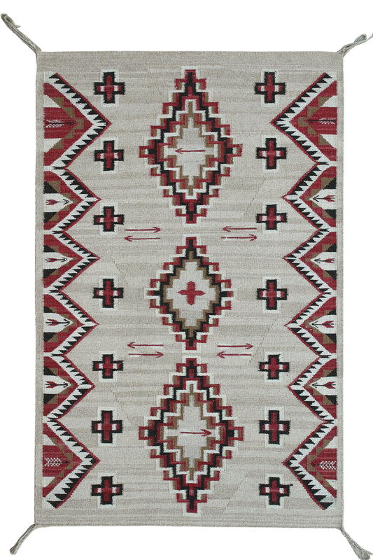 A rectangular woven rug with a Southwestern geometric pattern, featuring red, black, and beige diamond motifs on a light gray background. Atlantica Organics curates antique and handmade rugs, Persian, Afghan, Tibetan, Pakistani, Turkish Oushak, Kilim, Khotan, tribal and contemporary textiles for luxury interiors, homes and real estate. Our collections connect timeless craftsmanship with interior design, furniture, fine art, architecture and modern living. Explore curated rugs, collectible textiles, natural 