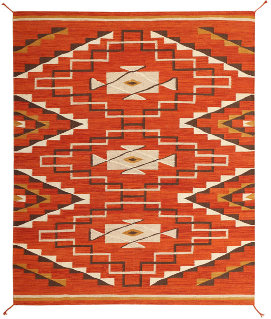 A rectangular woven area rug with a bold Southwestern geometric pattern in terracotta orange, cream, dark brown, and tan, shown flat against a white background.Atlantica Organics curates antique and handmade rugs, Persian, Afghan, Tibetan, Pakistani, Turkish Oushak, Kilim, Khotan, tribal and contemporary textiles for luxury interiors, homes and real estate. Our collections connect timeless craftsmanship with interior design, furniture, fine art, architecture and modern living. Explore curated rugs, collecti