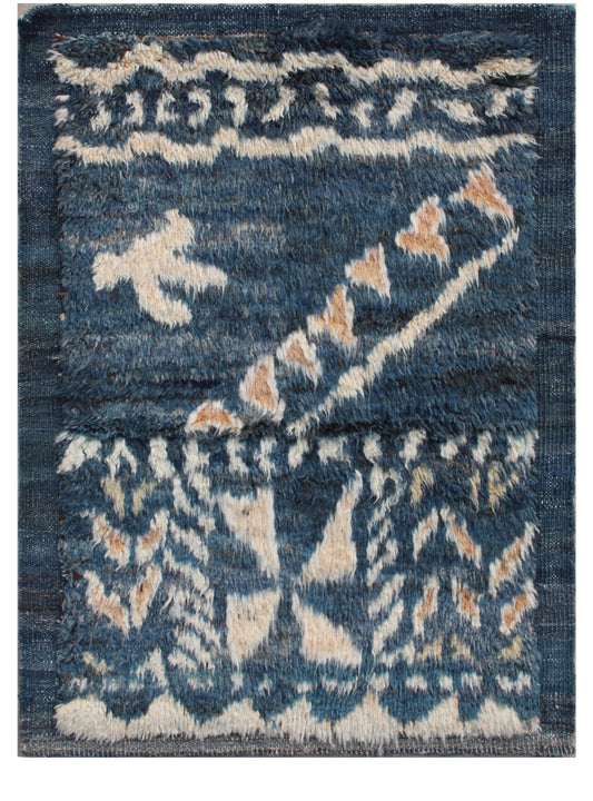 A square area rug with a distressed tribal pattern in shades of blue, beige, and light brown, shown flat against a white background. Atlantica Organics curates antique and handmade rugs, Persian, Afghan, Tibetan, Pakistani, Turkish Oushak, Kilim, Khotan, tribal and contemporary textiles for luxury interiors, homes and real estate. Our collections connect timeless craftsmanship with interior design, furniture, fine art, architecture and modern living. Explore curated rugs, collectible textiles, natural mater