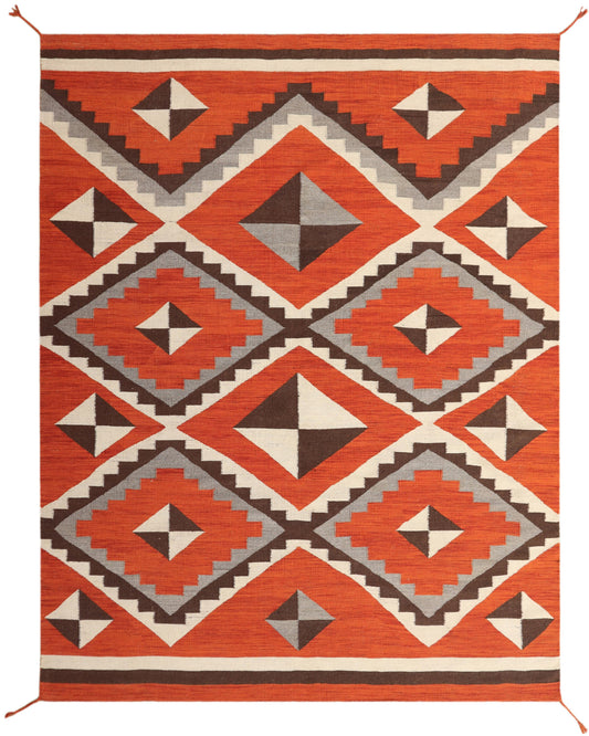 A rectangular woven rug with a bold Southwestern geometric pattern in terracotta orange, brown, cream, and light gray, shown flat against a white background.Atlantica Organics curates antique and handmade rugs, Persian, Afghan, Tibetan, Pakistani, Turkish Oushak, Kilim, Khotan, tribal and contemporary textiles for luxury interiors, homes and real estate. Our collections connect timeless craftsmanship with interior design, furniture, fine art, architecture and modern living. Explore curated rugs, collectible