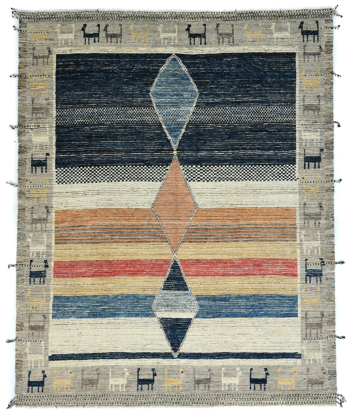 A square woven rug with a Southwestern geometric design, featuring a central diamond motif in blue, orange, red, and black on a cream and gray background with a decorative border. Atlantica Organics curates antique and handmade rugs, Persian, Afghan, Tibetan, Pakistani, Turkish Oushak, Kilim, Khotan, tribal and contemporary textiles for luxury interiors, homes and real estate. Our collections connect timeless craftsmanship with interior design, furniture, fine art, architecture and modern living. Explore cu
