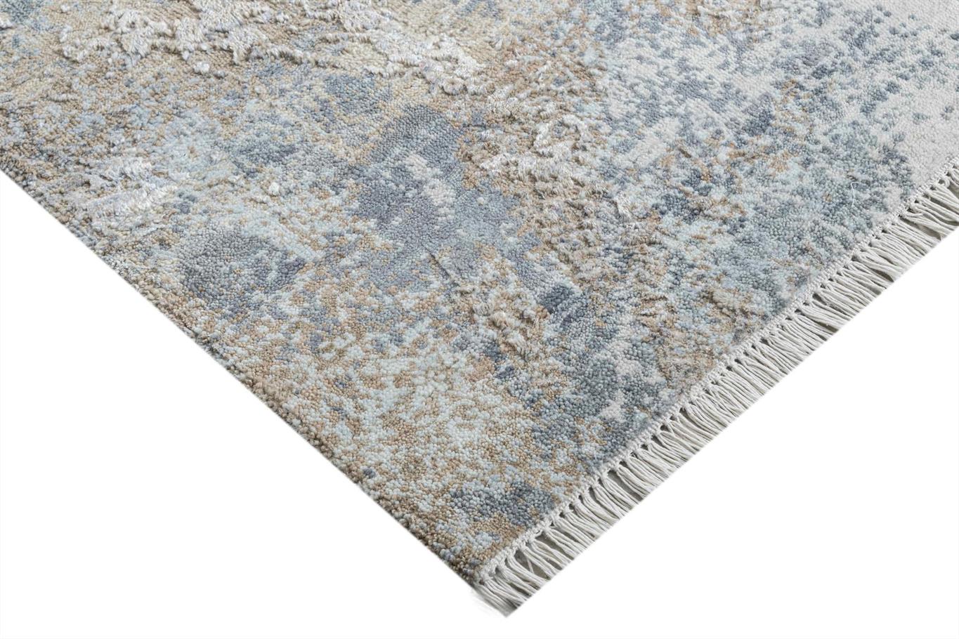 Close-up of a textured rug with geometric pattern and fringed edge on a white background Atlantica Organics curates antique and handmade rugs, Persian, Afghan, Tibetan, Pakistani, Turkish Oushak, Kilim, Khotan, tribal and contemporary textiles for luxury interiors, homes and real estate. Our collections connect timeless craftsmanship with interior design, furniture, fine art, architecture and modern living. Explore curated rugs, collectible textiles, natural materials, cultural heritage, sustainable design 