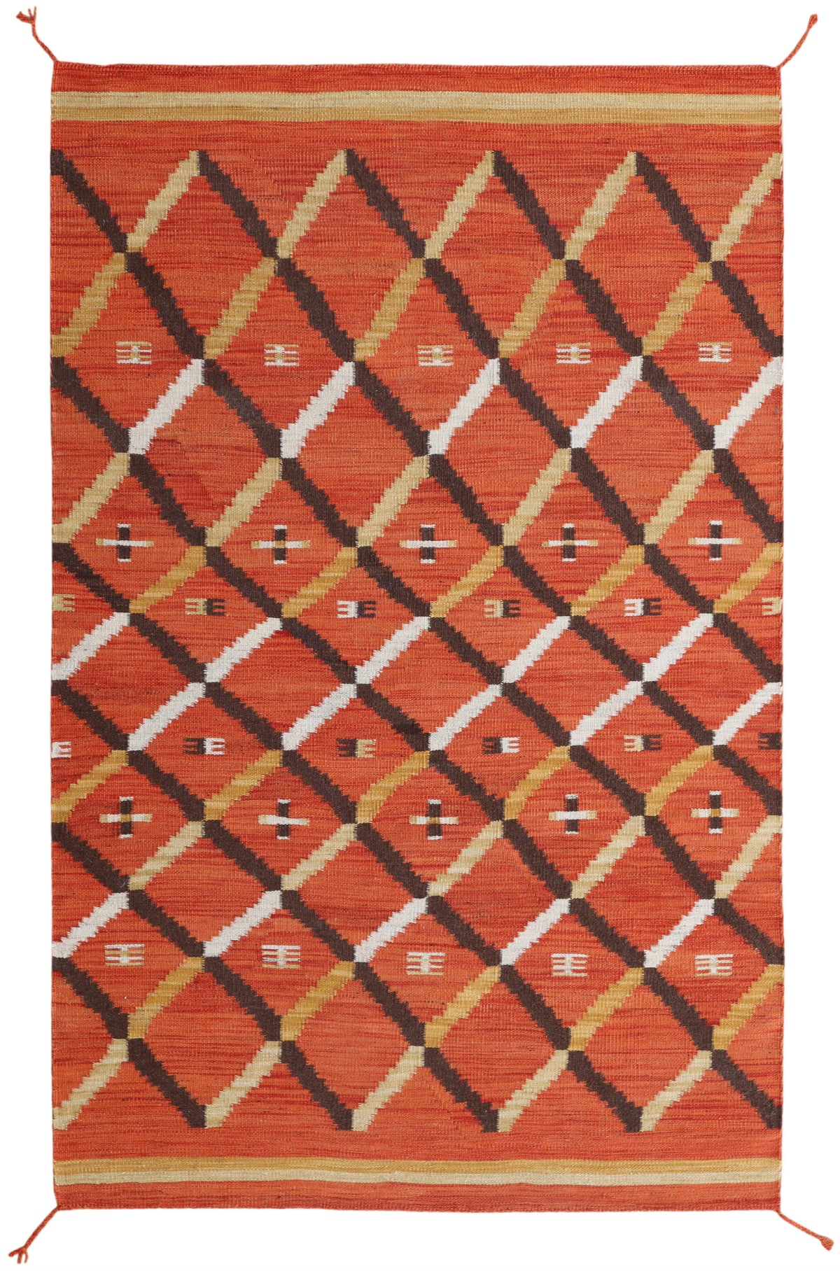 A square woven area rug with a bold geometric diamond pattern in rust orange, black, white, and tan, finished with a matching orange border and small corner ties.Atlantica Organics curates antique and handmade rugs, Persian, Afghan, Tibetan, Pakistani, Turkish Oushak, Kilim, Khotan, tribal and contemporary textiles for luxury interiors, homes and real estate. Our collections connect timeless craftsmanship with interior design, furniture, fine art, architecture and modern living. Explore curated rugs, collec