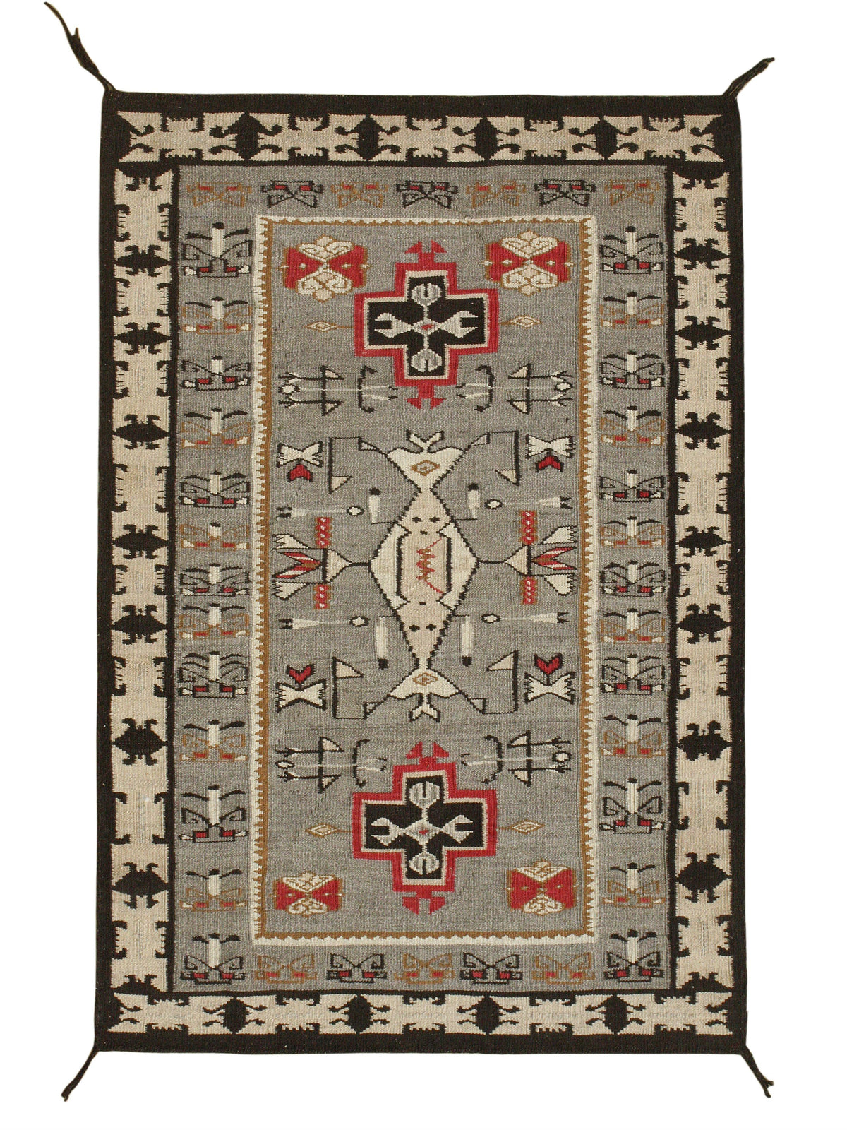 A rectangular woven rug with a Southwestern geometric pattern, featuring a central gray field, beige borders, and red, black, and white motifs. Atlantica Organics curates antique and handmade rugs, Persian, Afghan, Tibetan, Pakistani, Turkish Oushak, Kilim, Khotan, tribal and contemporary textiles for luxury interiors, homes and real estate. Our collections connect timeless craftsmanship with interior design, furniture, fine art, architecture and modern living. Explore curated rugs, collectible textiles, na